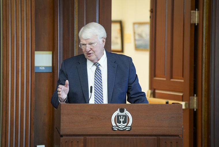 A man speaking at a podium